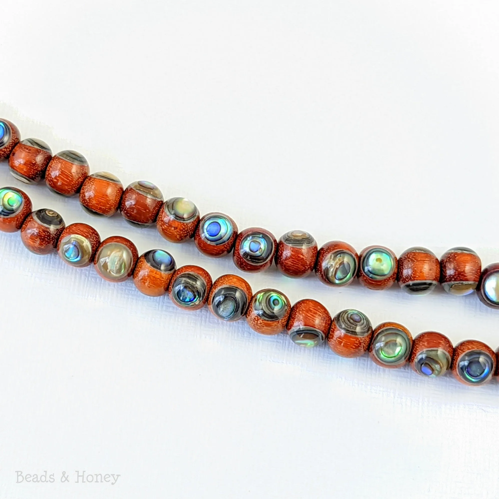 Sibucao Wood with Abalone Shell Inlay Round 7mm - 8mm (8-Inch Strand)