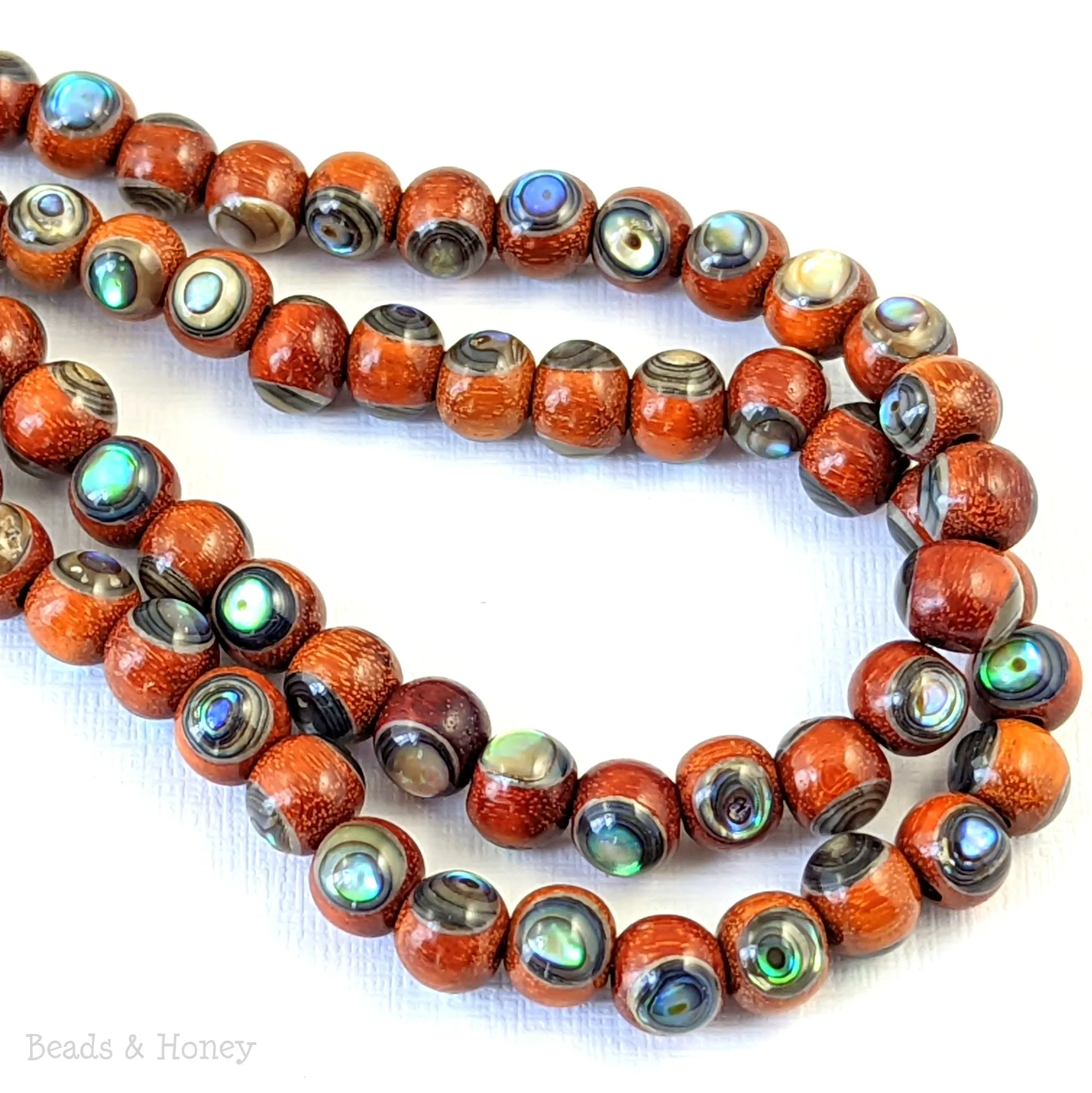 Sibucao Wood with Abalone Shell Inlay Round 7mm - 8mm (8-Inch Strand)